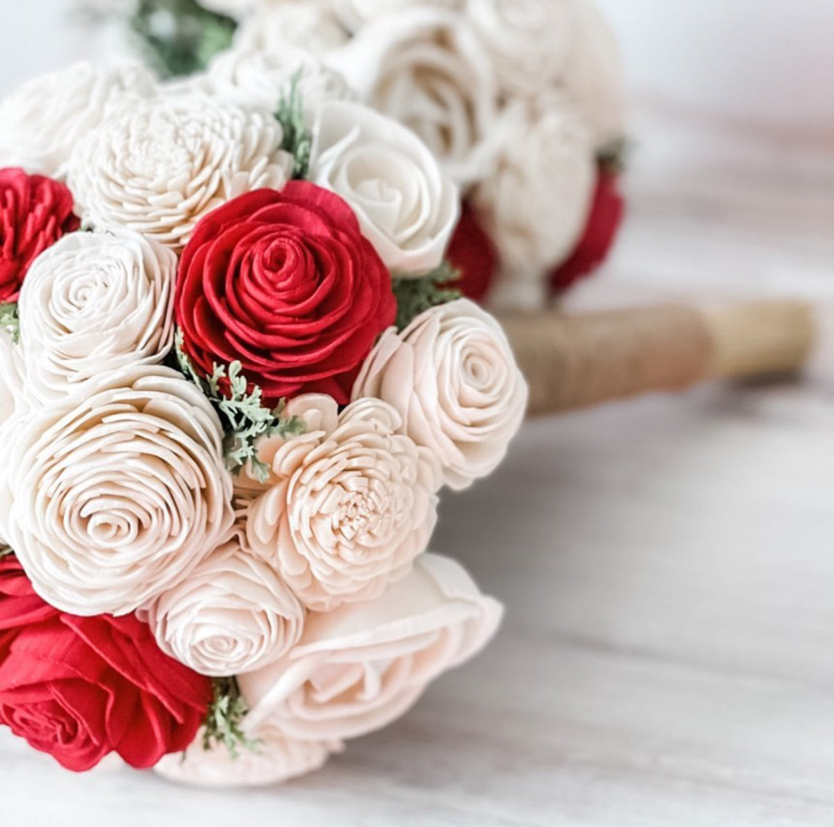 Bouquet of red and white roses on a light background