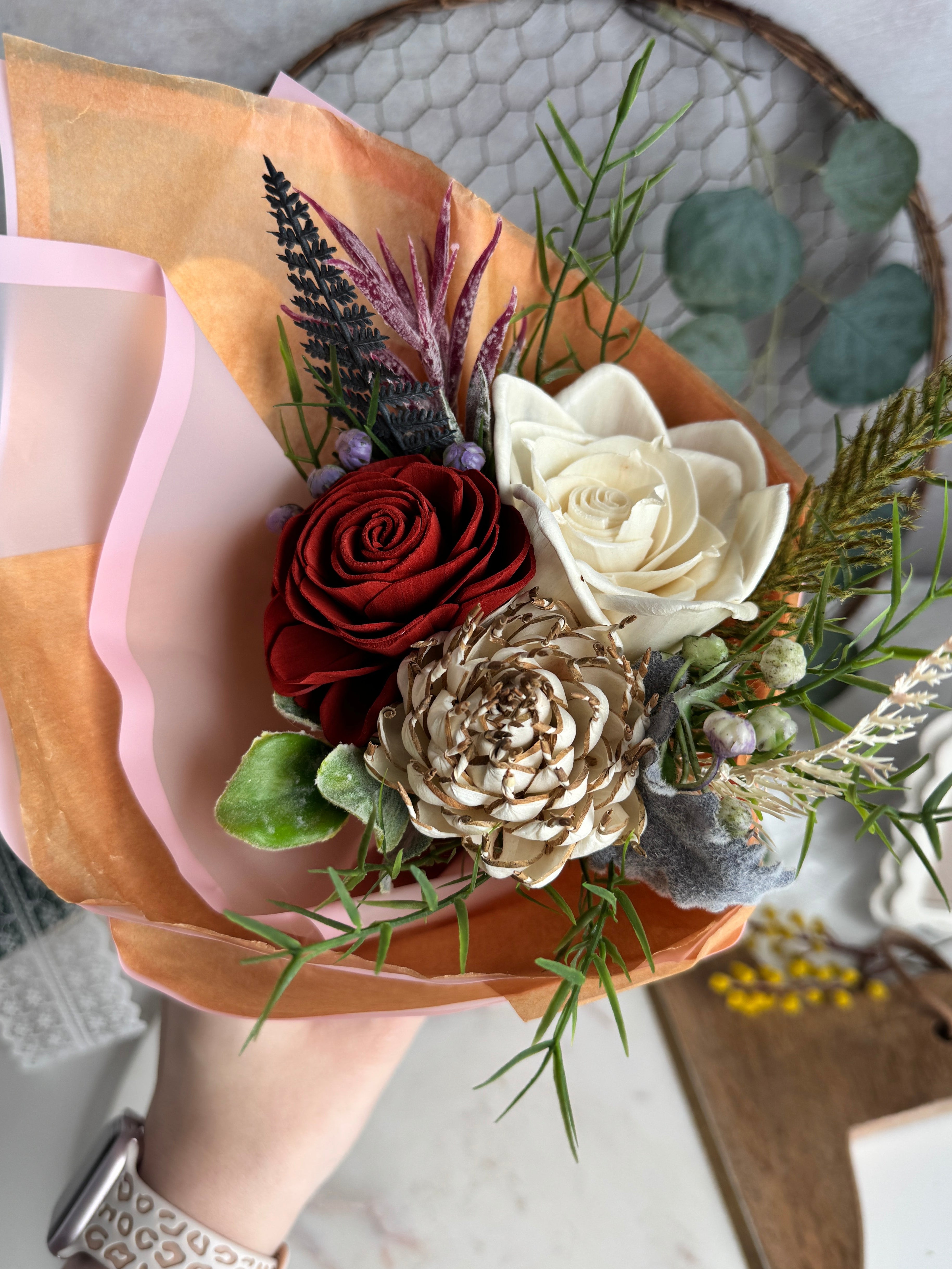 Bouquet of flowers with a decorative napkin on a textured surface
